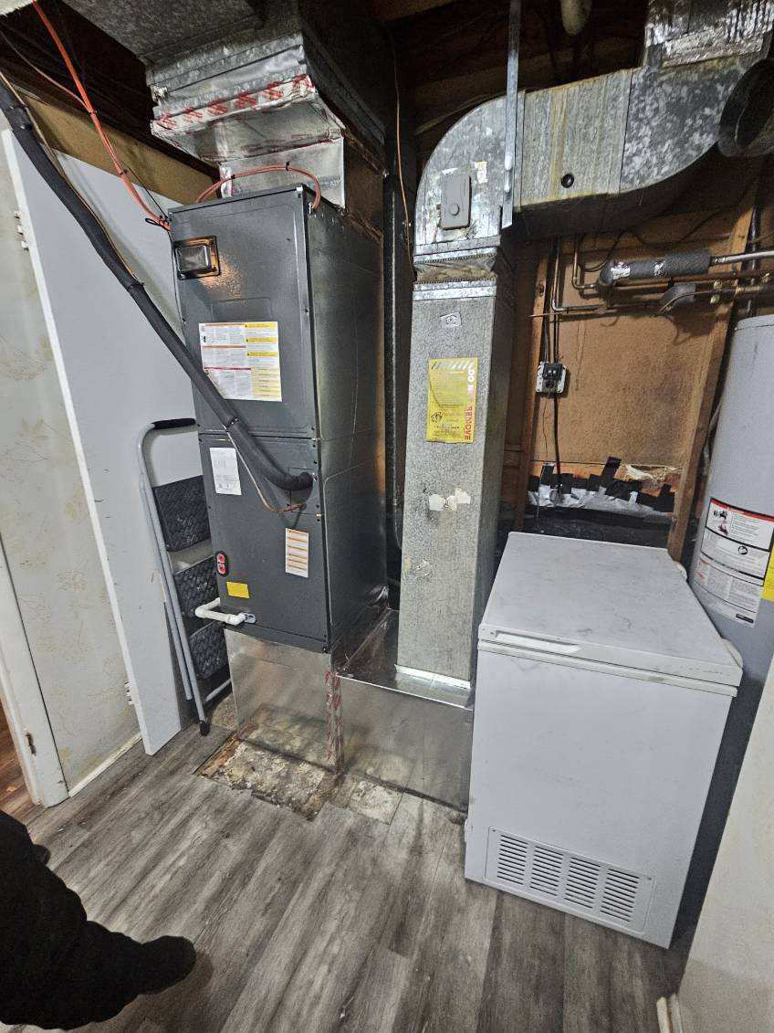 Air handler and ductwork in basement utility space