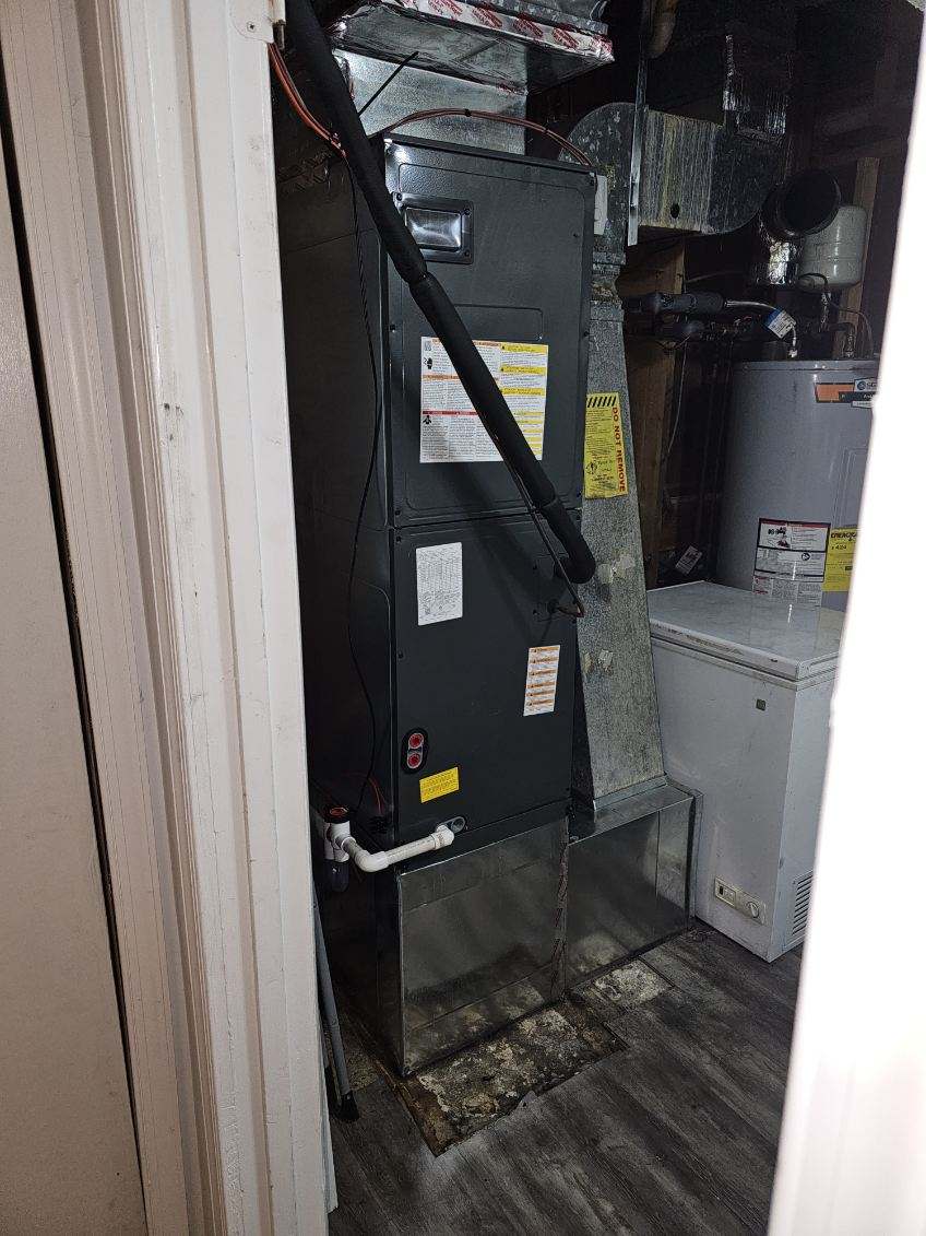 Indoor air handler unit with refrigerant lines and ductwork